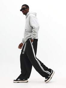 SUMWON Bequeme klassische Jogginghose mit seitlichem Streifendetail Logo-Muster, elastischer Knöchel, lässig, locker geschnitten, entspannter Winterwear Uni-Look - Schwarz - Übersicht 1