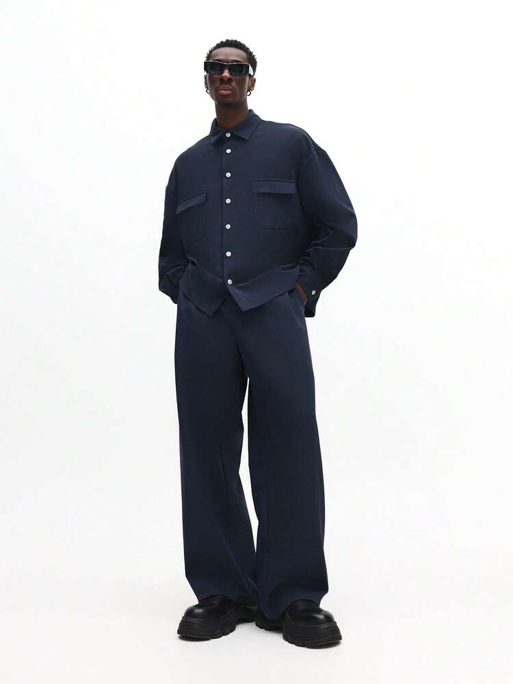 Completo camicia con bottoni e pantaloni a gamba larga