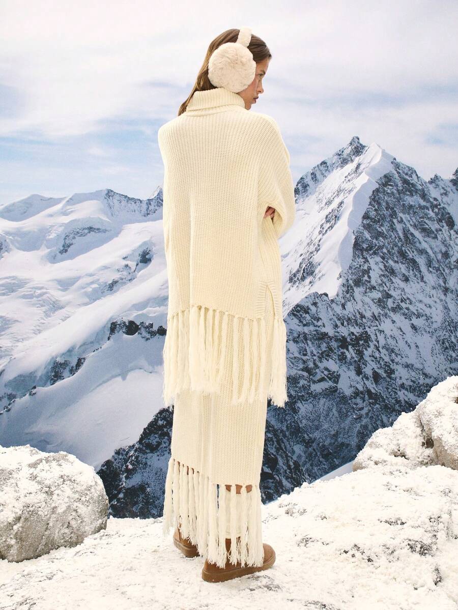 Nöista Conjunto de dos piezas de punto que presenta un cálido suéter de cuello alto a juego con una falda con detalles de flecos, ofreciendo una silueta cálida y elegante perfecta para los atuendos de invierno de las mujeres; un conjunto texturizado y versátil que ofrece un estilo de temporada sin esfuerzo para looks casuales de invierno, vestimenta diaria refinada, atuendos festivos de verano y celebraciones primaverales elegantes. - Blanco - Ver 1