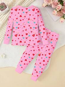 Conjunto de pijama de punto con cuello redondo, estampado de unicornio, bloque de color y luz en el corazón que brilla en la oscuridad para niñas, de tela elástica, cómodo y ajustado, con manga larga y pantalones, color rosa