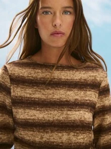 Nöista Cozy Striped Knit Sweater In Brown Tones, Featuring An Asymmetric Button Detail For A Modern Twist. Perfect For Winter Outfits, Christmas Gatherings, Or A Relaxed New Year Look, This Piece Combines Comfort And Style For An Effortlessly Chic Women's Wardrobe.