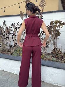 Andrea Bello Conjunto de oficina elegante para ir al trabajo y tomar el té de la tarde, compuesto por una chaqueta blazer sin mangas con cuello y bajo asimétrico, con decoración de hebilla metálica en la cintura, combinada con pantalones de cintura elástica, conjunto de 2 piezas, para primavera/verano