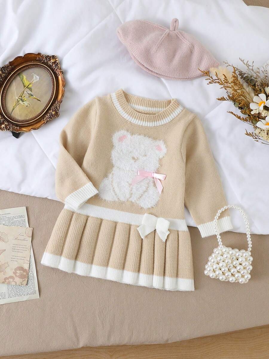 Souflis Souflis Vestido de línea A de punto jacquard con cuello redondo y decoración de lazo hecho a mano, bajo plisado, cómodo para salidas, viajes y uso en casa para niñas bebé - Albaricoque - Ver 1