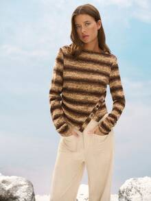 Nöista Cozy Striped Knit Sweater In Brown Tones, Featuring An Asymmetric Button Detail For A Modern Twist. Perfect For Winter Outfits, Christmas Gatherings, Or A Relaxed New Year Look, This Piece Combines Comfort And Style For An Effortlessly Chic Women's Wardrobe.