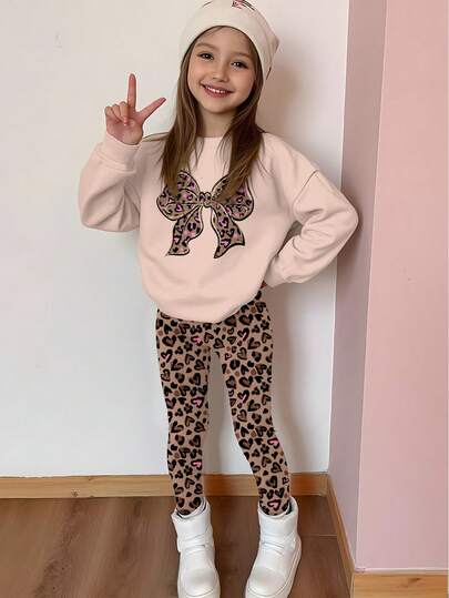 SHEIN Leap Crew 2 件套奶油色豹纹闪光蝴蝶结装饰青少年女孩休闲宽松厚实柔软舒适圆领长袖运动衫和紧身裤套装，适合秋冬季