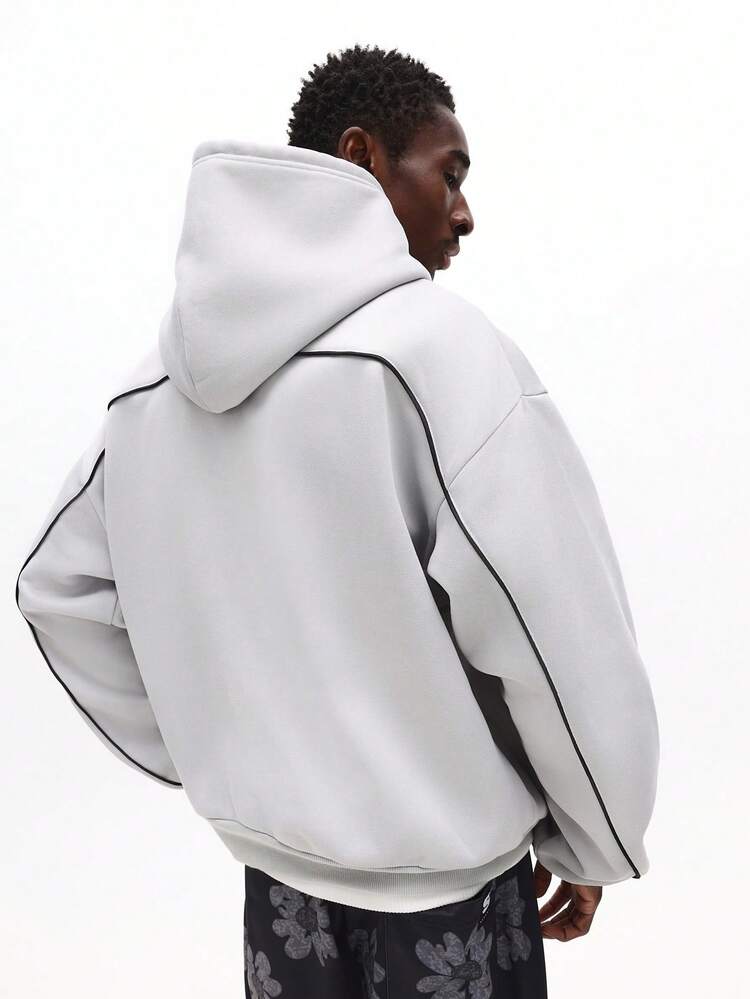 Luźna bluza z kapturem, ściągaczem i kieszenią