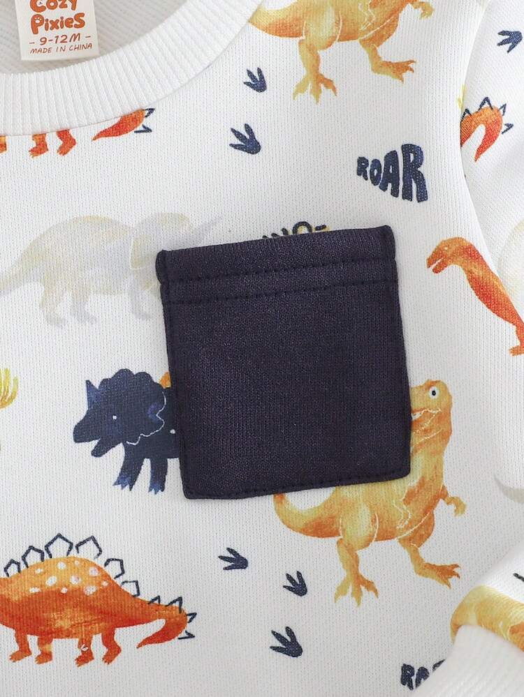 Cozy Pixies 2件套男婴卡通恐龙图案针织保暖内衬柔软圆领长袖卫衣和松紧腰裤套装，适合冬季宝宝秋冬季节穿着。恐龙印花婴儿套装，男婴长袖套装，新生儿男婴长裤休闲套装，2件套新生儿男婴套装，长袖长裤，男婴秋冬季节恐龙套装 - 白色 - 查看 6