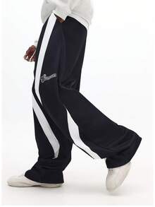 Quần jogger dáng rộng SUMWON phối sọc tương phản bên hông, dây rút eo, có chi tiết logo, kiểu dáng bán chạy INS, chất vải dày dặn, thoải mái giữ ấm tối đa, trang phục gia đình đồng bộ cho các cặp đôi, phối đồ thời trang, bộ đồ gia đình ấm cúng, hoàn hảo cho trang phục thường ngày và ngày lễ. Màu trơn - màu đen - Xem 4