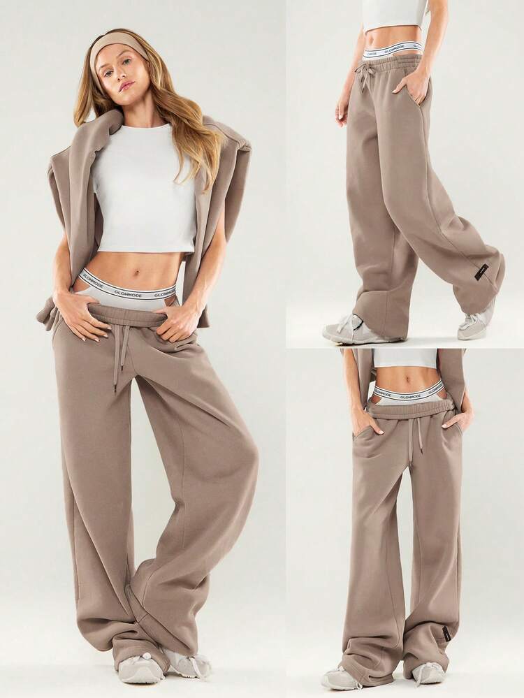 Pantalon de jogging ample en molleton épais avec taille ajustable à cordon de serrage, jambes larges, poches latérales, pour un usage quotidien et décontracté. Thermique et chaud pour l'hiver.