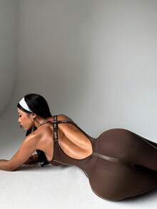 Dewbera Women's Letter Print Backless Criss-Cross Design Flare Jumpsuit - Brown - View 5