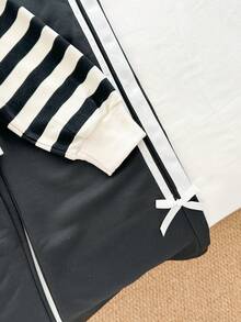 Genkimix Kids Conjunto de 2 piezas de niña preadolescente con sudadera de cuello redondo casual con rayas y decoración de lazo + pantalones rectos casuales con decoración de cinta - Negro - Ver 5