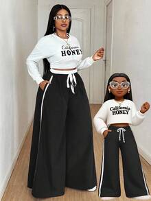 Maweii 大码女式拼色拼接侧丝带前系蝴蝶结松紧腰阔腿裤，时尚设计，适合派对、日常穿着、百搭，秋冬 - 黑與白 - 查看 1