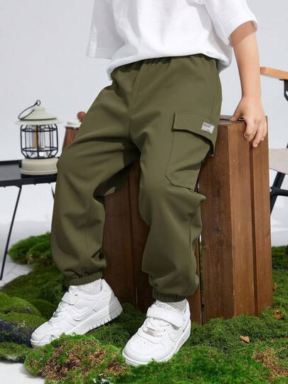 SHEIN Pantalones cargo holgados con cordón, estampado gráfico deportivo y bolsillos, para niños preadolescentes, adecuados para ir y venir, la escuela, el diario, las vacaciones, los deportes, primavera/verano/otoño/invierno