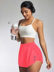 Core Rhythm Quần short thể thao họa tiết chữ xếp ly màu hồng neon đa năng thoải mái - Hồng - Xem 7