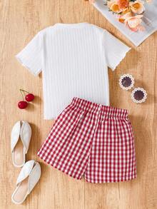 SHEIN Conjunto de 2 piezas de niña joven para vacaciones: Camiseta de punto de manga corta con cuello redondo y estampado de cerezas refrescante y dulce + Pantalones cortos holgados a cuadros rojos, para vacaciones, verano, viajes - Blanco - Ver 2