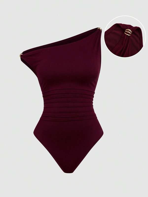 Sweetra Plus Size Women's Solid Color Asymmetric Shoulder Casual Bodysuit With Metal Decor And Ruffle, Slim Fit Bodysuit