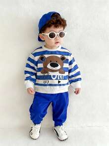 SHEIN Playful Pals 2 Stück/Set Kleinkind/Säugling Kinder Cartoon Bär Muster blau & weiß gestreifter Sweatshirt und Hose Set, geeignet für Herbst/Winter, Säuglingssportoutfit Set, Säuglings blauer Sportanzug Set, Säuglings/Baby Jungen Winterbekleidung, Säuglings/Baby Jungen Streetwear Set, 6M-3T Säuglings/Baby Jungen Sportanzug Set, Baby Jungen Streetwear, Säuglings/Baby Jungen Bekleidung, Jungen Sportanzug Set, Säuglings/Baby Jungen Streetwear blauer Outfit Baby Jungen Baby Lässig Outfit Baby Jungen Trainingsanzug - Blau - Übersicht 9