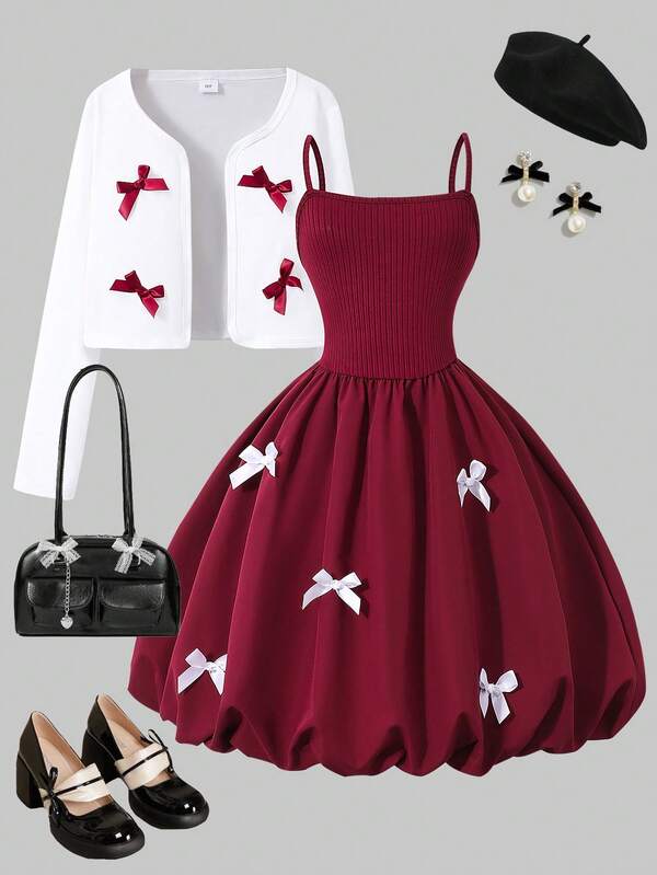 Conjunto de niña preadolescente con cárdigan negro elegante con lazo y vestido blanco con tirantes de lazo y manga abullonada