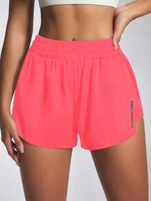 Core Rhythm Quần short thể thao họa tiết chữ xếp ly màu hồng neon đa năng thoải mái - Hồng - Xem 5