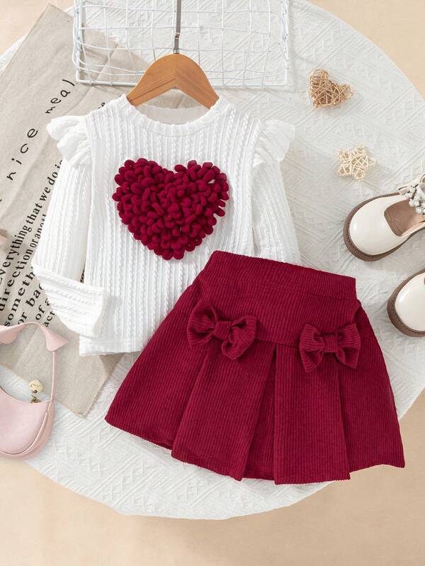 Niña de 4-7 años Blusa de punto blanca casual y dulce con decoración de lazo y volantes en las mangas largas de cuello redondo y Falda plisada de pana rosa con cintura elástica, adecuada para uso diario y salidas casuales