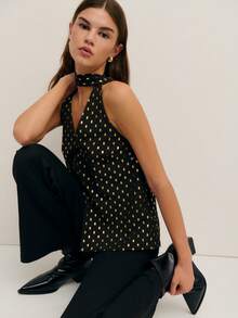 Nöista 这款别致的黑色上衣饰有金色点缀，采用挂脖领口和钥匙孔前襟设计，尽显大胆精致的气质。无论是生日派对、优雅庆典，还是春假外出，它都是女士春假穿搭系列中的亮点之选。 - 黑色 - 查看 1