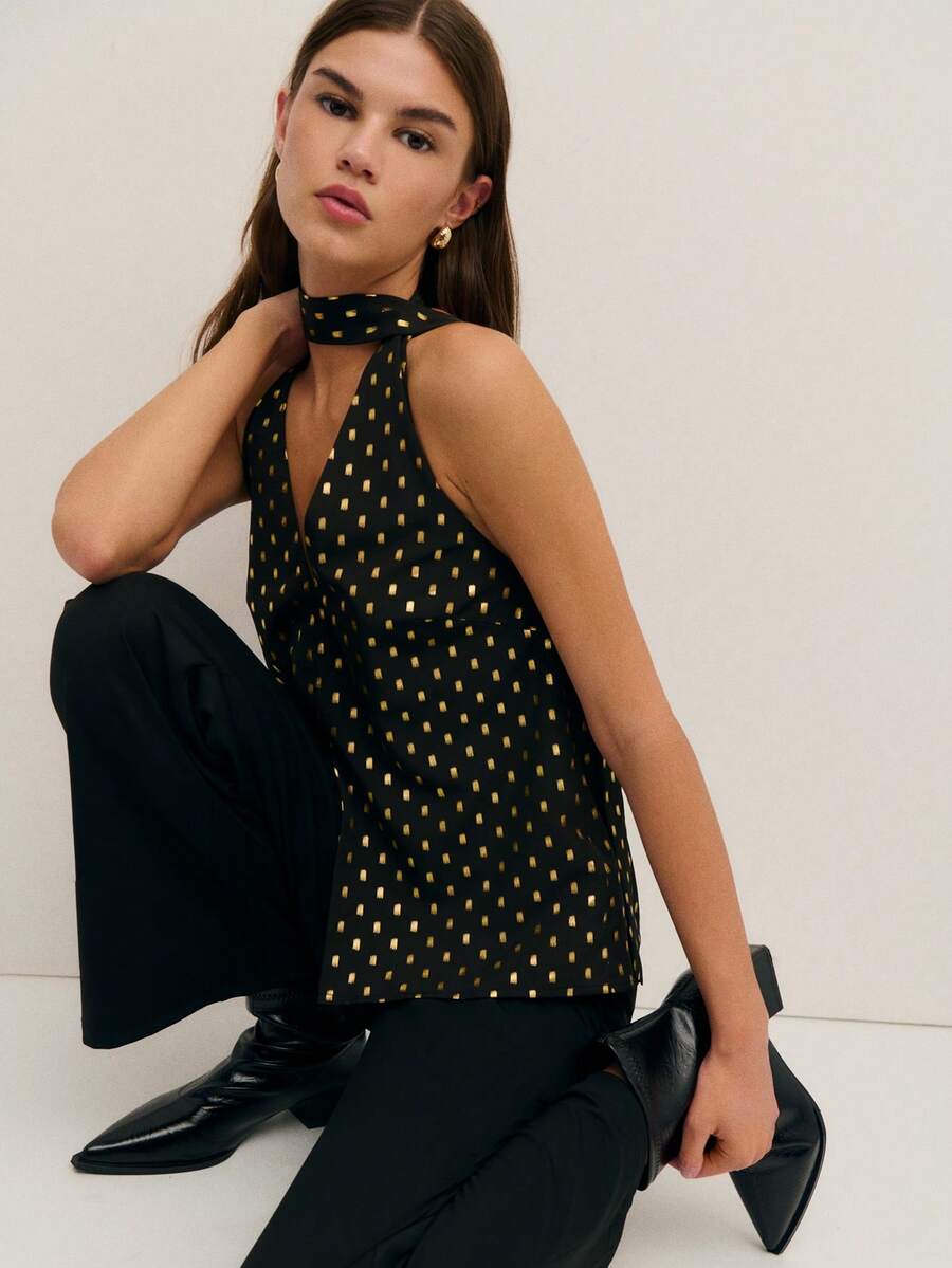 Nöista 这款别致的黑色上衣饰有金色点缀，采用挂脖领口和钥匙孔前襟设计，尽显大胆精致的气质。无论是生日派对、优雅庆典，还是春假外出，它都是女士春假穿搭系列中的亮点之选。 - 黑色 - 查看 1