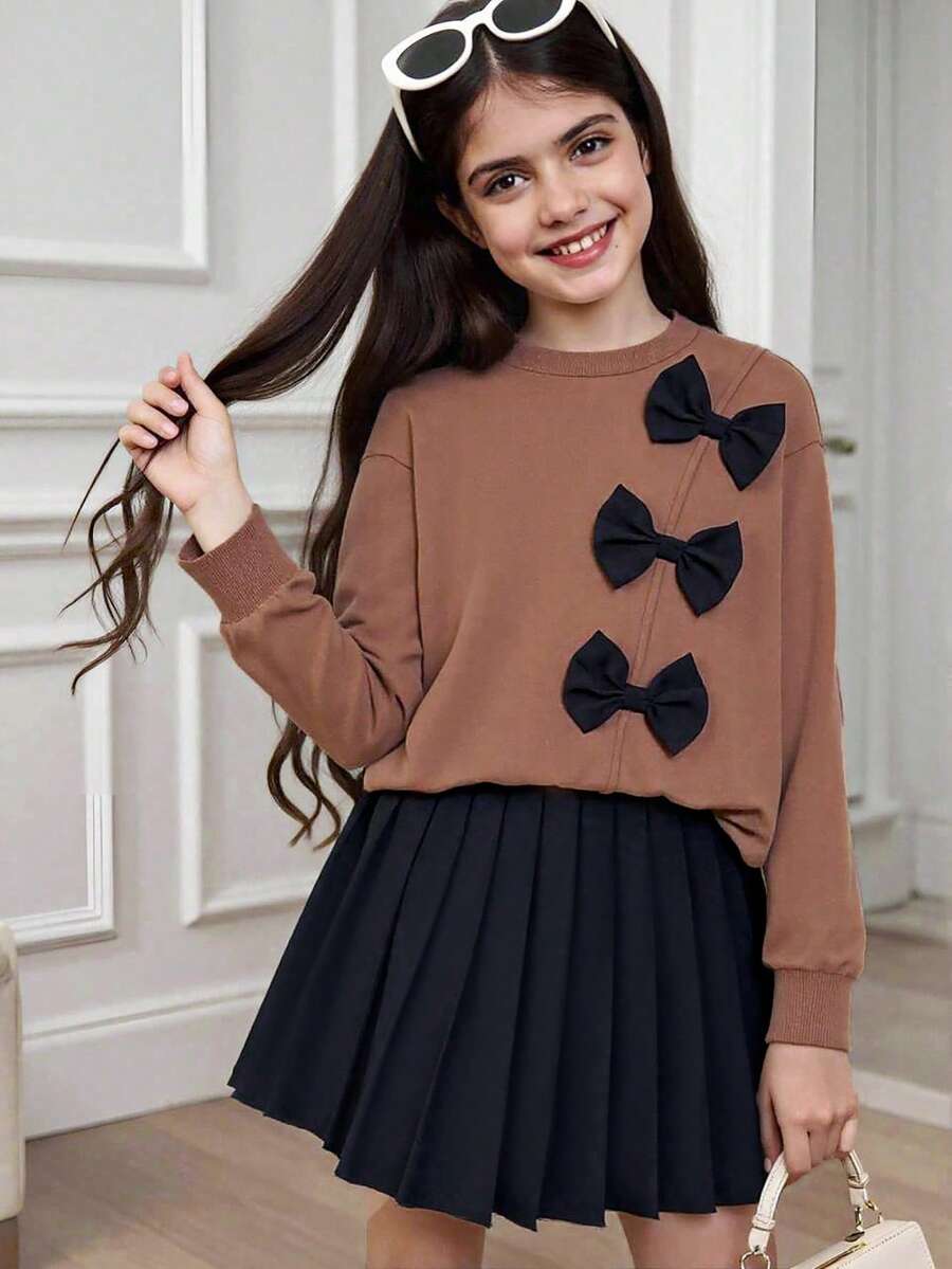 Bộ 2 món: Áo nỉ dài tay họa tiết nơ và chân váy mini xếp ly màu đen - Cà phê nâu - Xem 1
