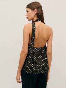 Nöista 这款别致的黑色上衣饰有金色点缀，采用挂脖领口和钥匙孔前襟设计，尽显大胆精致的气质。无论是生日派对、优雅庆典，还是春假外出，它都是女士春假穿搭系列中的亮点之选。 - 黑色 - 查看 2