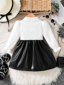 SHEIN Playful Pals 女婴领口泡泡袖二合一A字裙。经典A字廓形，适合各种体型的宝宝。独特的领口设计增添一丝正式感，巧妙的泡泡袖设计则甜美俏皮。二合一设计营造视觉深度。无论是外出还是休闲居家，这款连衣裙都能展现宝宝活泼可爱的天性。 - 黑色 - 查看 2