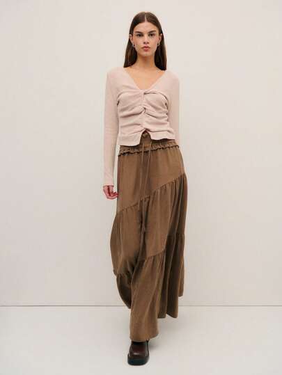 Nöista Brown Tiered Maxi Skirt With A Smocked Waistband And Drawstring Tie, Offering A Lightweight, Flowy Boho-Chic Vibe. Perfect For Fall Outfits, Vacation Looks, Easygoing Going Out, And Everyday Elegance. This Versatile Skirt Pairs Beautifully With Cozy Knits For Winter, Adding Effortless Style To Women's Autumn And Winter Wardrobes.