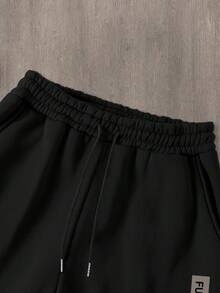 Manfinity Homme Bộ 2 quần nỉ và áo nỉ in khẩu hiệu tương lai và họa tiết đồ họa dành cho nam, thời trang thu/đông cho nam - màu đen - Xem 4