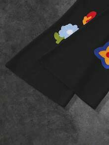 Manfinity EMRG Quần nỉ ống loe rộng rãi có dây rút túi eo họa tiết hoa dành cho nam - màu đen - Xem 6