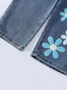 年轻女孩时尚雪花水洗做旧刺绣喇叭牛仔裤