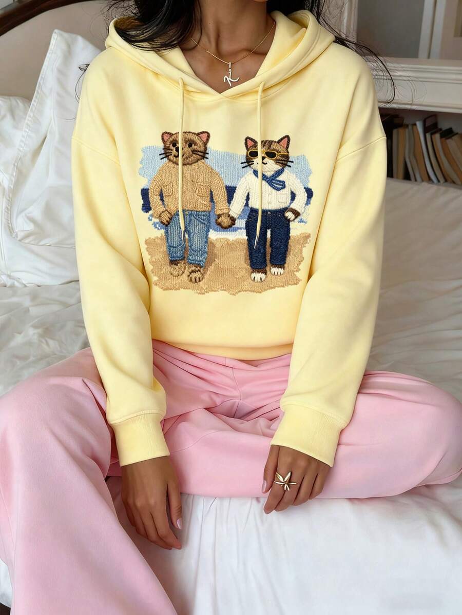 CovetEZ Moletom casual minimalista com capuz e estampa de urso amarelo-creme, moletom folgado de manga comprida com estampa chique amarelo-creme para mulheres, outono/inverno