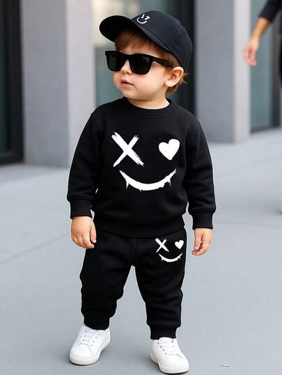 SHEIN 2pcs/Set Baby Boy Cute Face Graphic Black Long Sleeve Crew Neck Sweatshirt And Pants Set, Suitable For Autumn/Winter, Baby Sportswear Set, Baby Black Tracksuit, Baby Boy Winter Clothes, Toddler Boy Street Outfit, 6M-3T