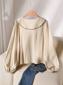 CosyJoli بلوزة قطن بياقة بيتر بان مطرزة بالأصداف مع ربطة أمامية وأكمام فانوس مقاسات كبيرة - لون مشمشي - مشاهدة 2