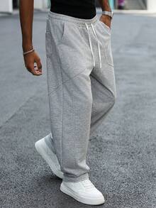 Manfinity Hypemode Pantalones de chándal grises casuales para hombres jóvenes con bolsillo grande y parche, pantalones de chándal grises, pantalones de chándal clásicos, pantalones largos de sudadera, pantalones de sudadera para hombre, pantalones de chándal grises para hombre, ropa de otoño/invierno para hombres