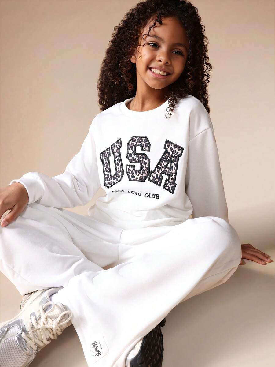 SUMWON Conjunto de sudadera con capucha y pantalón de chándal para niñas con estampado de leopardo y texto "USA" para uso casual en el hogar - Blanco - Ver 1