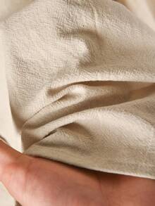 CosyJoli بلوزة قطن بياقة بيتر بان مطرزة بالأصداف مع ربطة أمامية وأكمام فانوس مقاسات كبيرة - لون مشمشي - مشاهدة 6