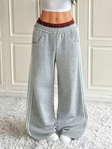 SHEIN EZwear Women's Wide-Leg Sweatpants With Red Plaid And Gray Knitwear At The Waist, Featuring Contrasting Stripes And Plaid Patchwork, And A Gray Thermal Lined Suitable For Winter Warmth.