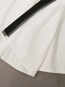 GlowEve Blusa de mujer con diseño de contraste blanco y negro, cuello en V y botones delanteros, elegante silueta de línea A que ciñe la cintura, ideal para maestras