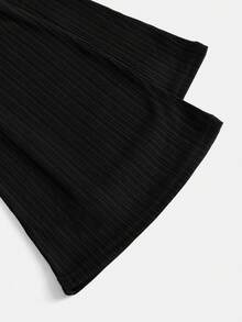 Leap Crew Tween Girls Spring Streetwear, Black Ribbed Solid Trousers, Cute High Waist Flared Pants, Comfortable Textured Fabric, High Stretch Black Flared Pants For Tween Girls