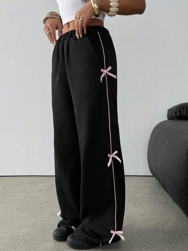SHEIN Pantalones de chándal holgados de color negro con lazo rosa para adolescentes, ropa de calle casual, gruesa y versátil