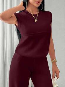 EURMUSE Two Pieces Sleeveless Knit Set Featuring Minimalist Crew Neck Top And High-Waisted Ribbed Pants In Soft Ivory - Burgundy - View 4