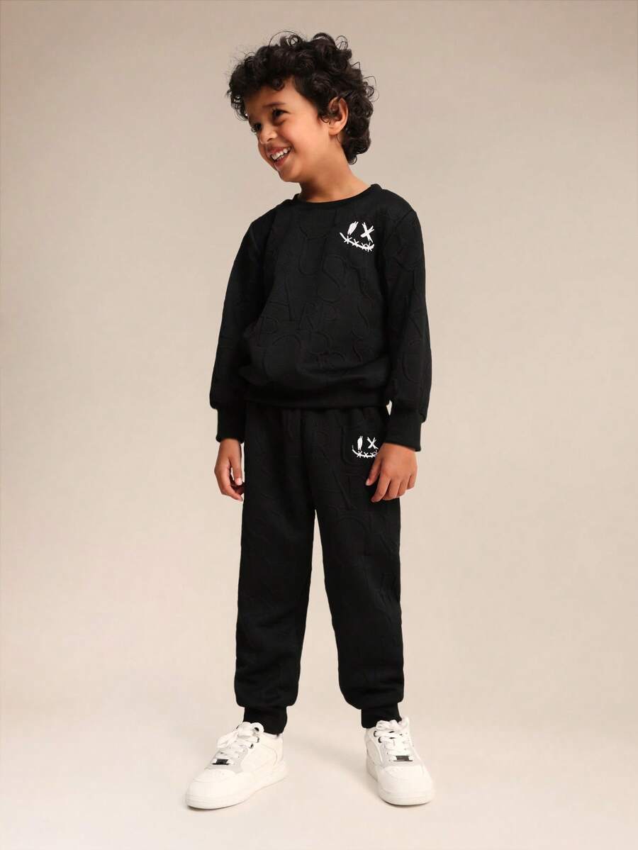 SUMWON Conjunto de sudadera con capucha y pantalón jogger para niños sin cordón en la capucha y bolsillo central - Negro - Ver 1