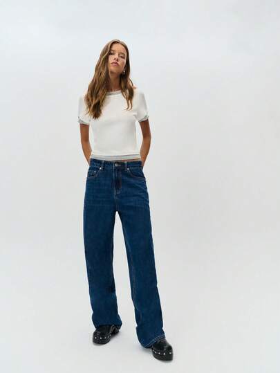 Nöista Jeans de mezclilla de pierna ancha con estiramiento en azul oscuro que ofrece una silueta relajada y moderna, adecuado para el uso diario y un fácil estilo invernal, combinando bien con suéteres, abrigos y looks casuales refinados para Navidad o Año Nuevo.