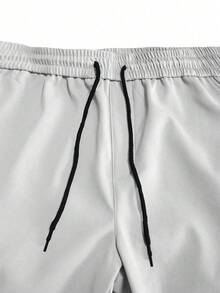 Manfinity Homme 男士纯色抽绳腰带工装口袋保暖休闲慢跑裤，灰色工装裤，适合街头穿搭、日常休闲、周末旅行、户外活动、探险旅行、轻松的工作环境或半正式场合，也是送给男友/丈夫、周年纪念日或圣诞节的理想礼物。 - 白色 - 查看 4