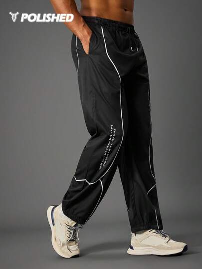 Manfinity Sport Polished Men's Slogan Print Drawstring Waist Pocket Loose Sweatpants Windbreaker Pants Men Athletic Pants Black And White Workout Pants Baggy Gym Clothes Sweat Pants