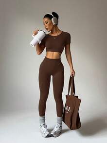 Easithlete Women's Solid Color Round Neck Short Sleeve Fitted Twist Hollow Short Top & Pants Sports Suit, Summer Brown Yoga Set Brown Gym Top Brown Workout Set Brown Athletic Set Yoga Dress - Brown - View 2