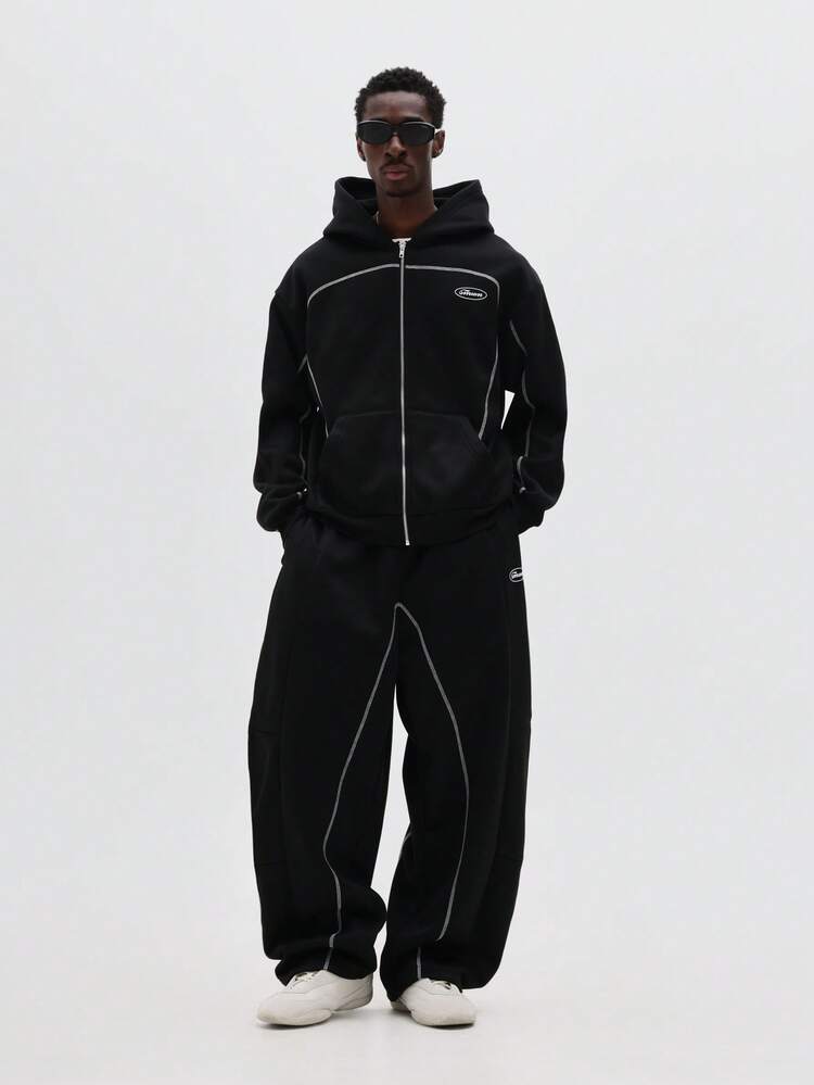 Completo tuta oversize con cappuccio e profili bianchi